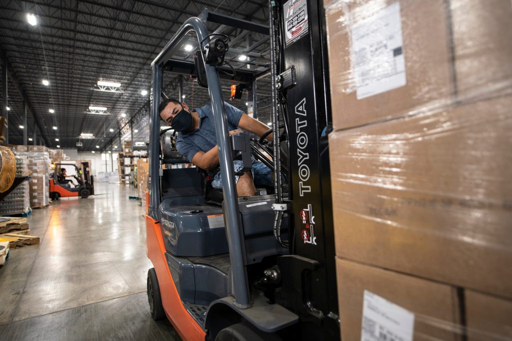 a forklift driver operating a forklift truck